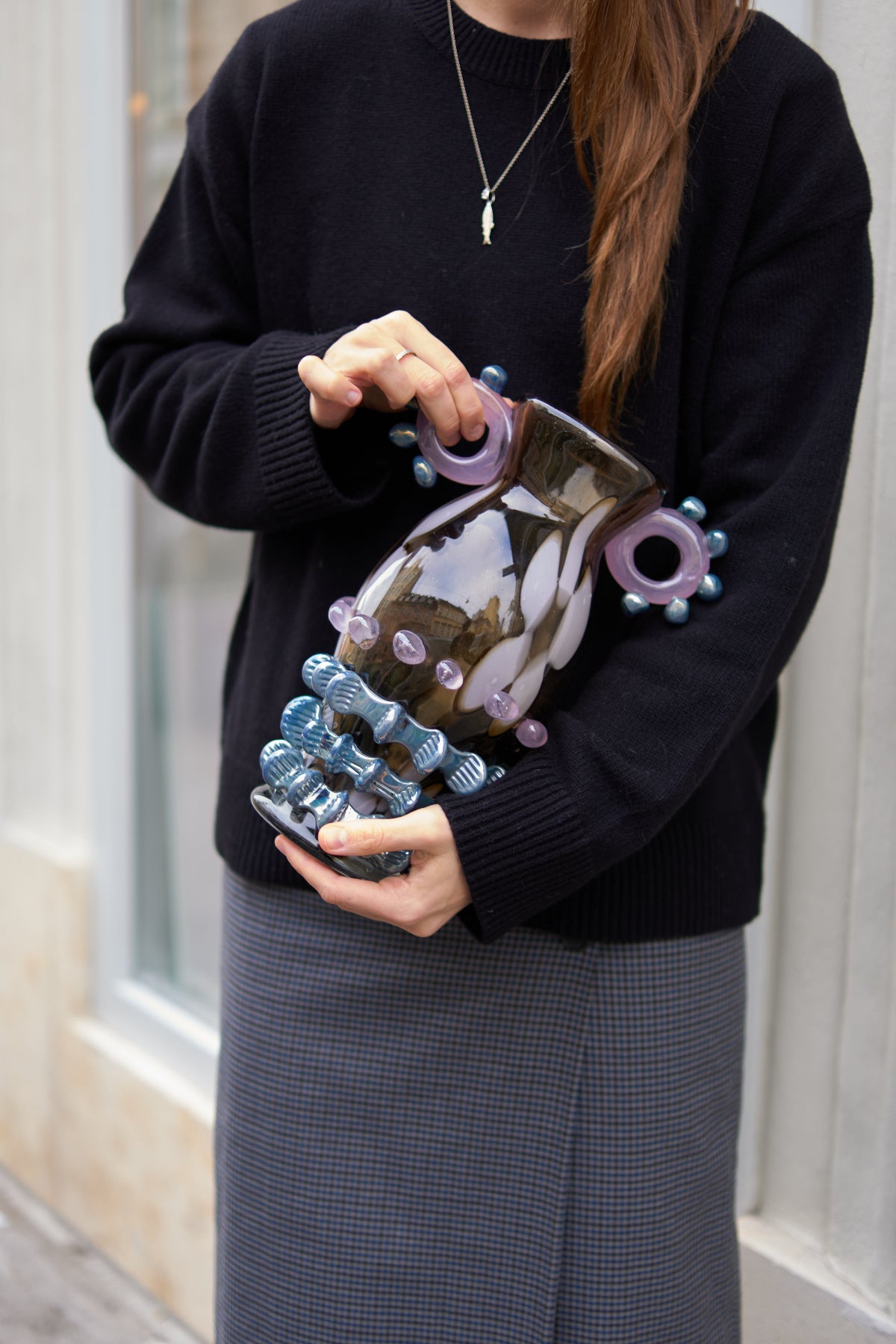 Handcrafted glass vase by Roksolana Hudoba, created in her studio in Lviv. This sculptural piece is conceived as an art object rather than a functional vessel, balancing a classical vase silhouette with expressive, almost animalistic surface forms. The glass appears to move organically, as if shaped by natural forces rather than tools, resulting in a vivid, tactile presence.